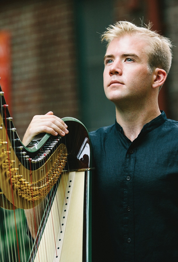 Ramsay holding harp