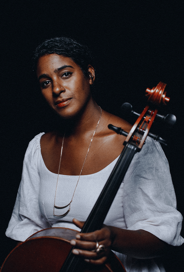 Leyla McCalla headshot with cello