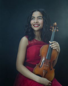 Amaryn Olmeda holding a violin