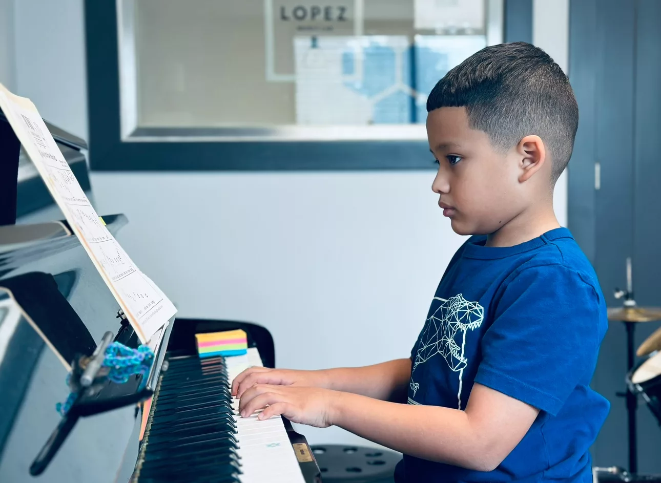 boy playing keyboard