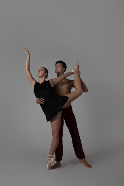 male and female students in dance pose