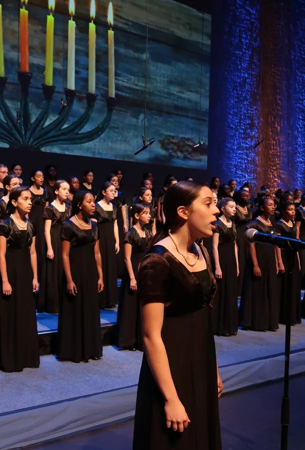 young students preforming on stage