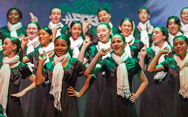 young students preforming on stage