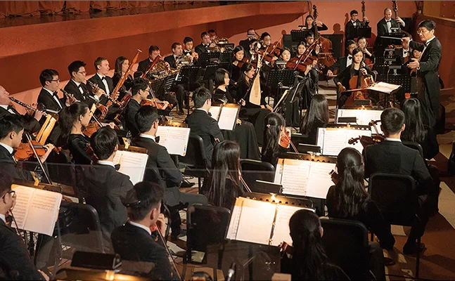 Shen Yun Orchestra playing with conductor