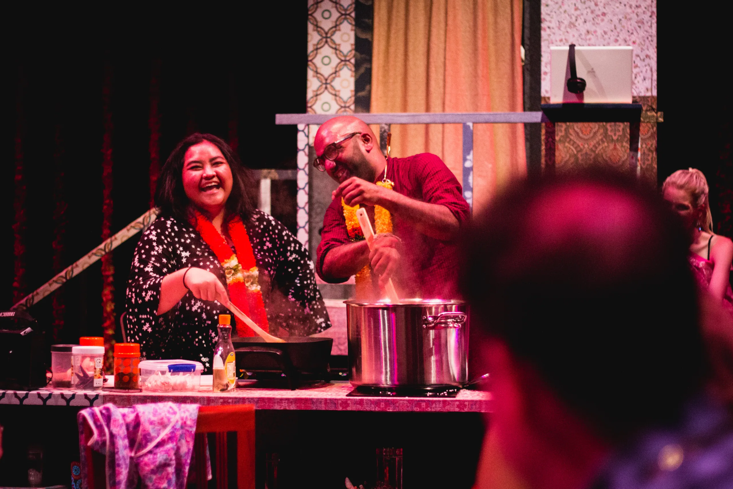 People cooking on stage. Photo Credit Ankita Singh