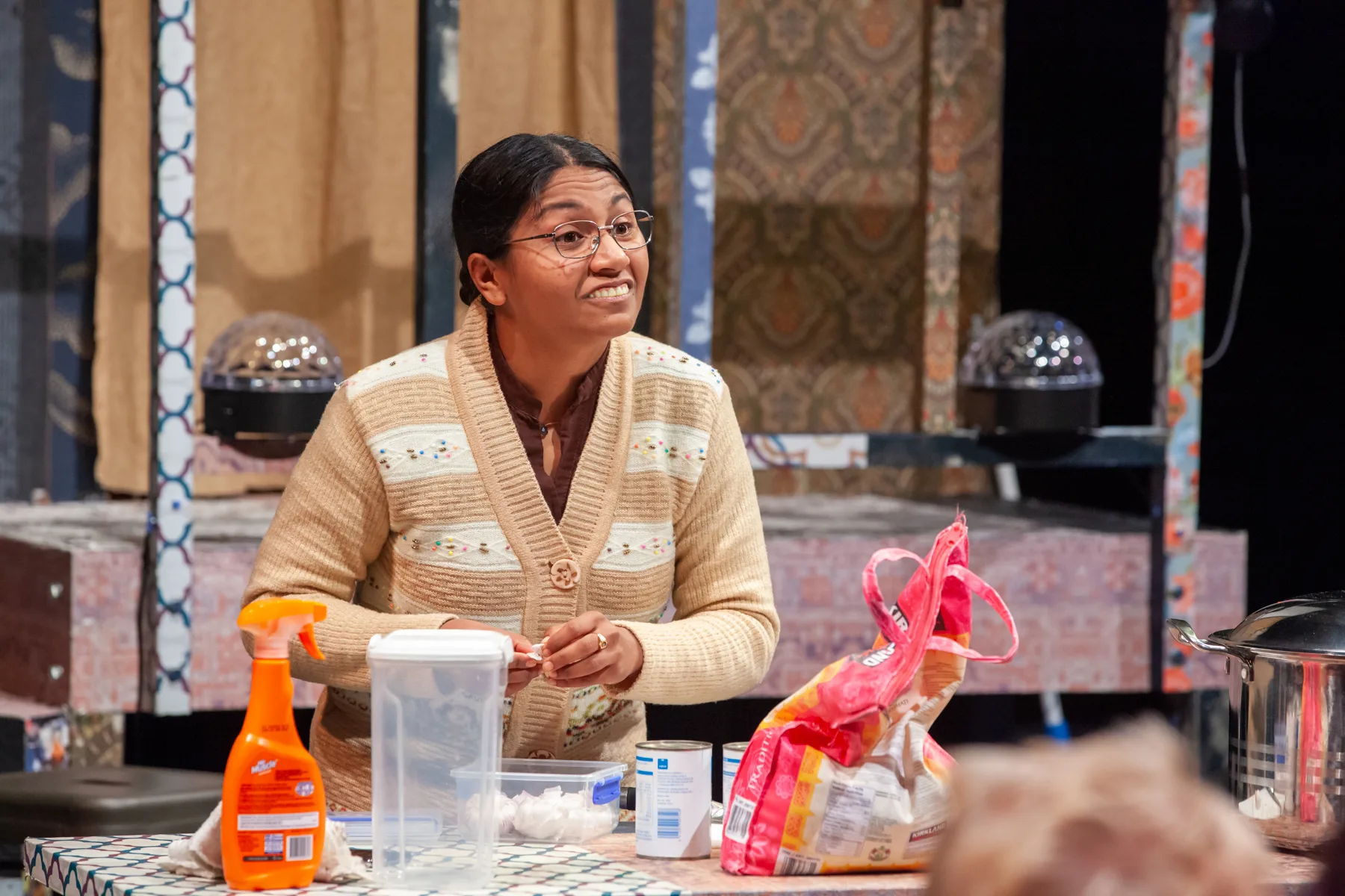 Mrs Krishnan in photo on stage cooking. Photo Credit grabb for image excellence